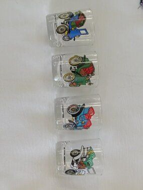 Collection of 4 vintage small glasses with a heavy base and old car designs